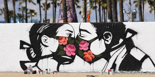 covid19_palm-trees-stand-behind-a-street-art-piece-by-artist-pony-news-photo